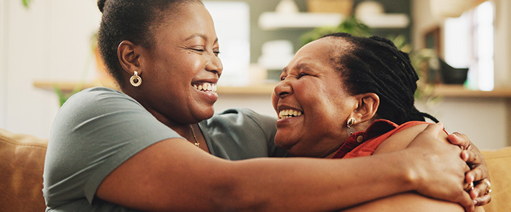 Image of an older mother and daughter hugging