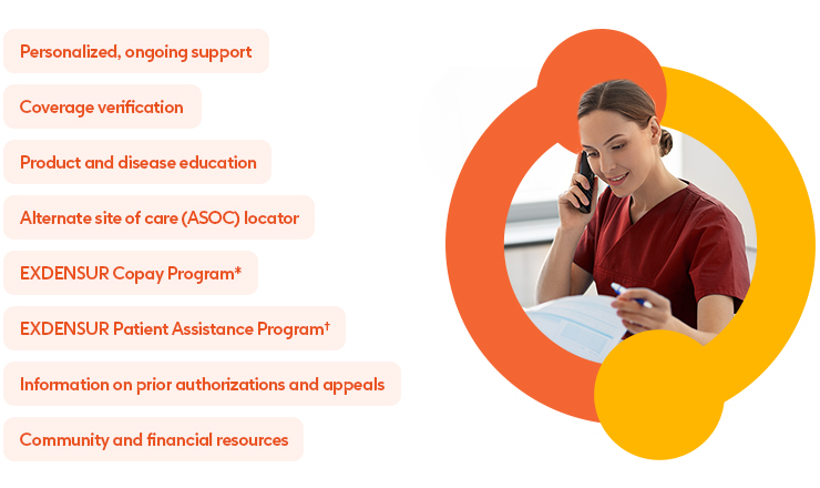 Female doctor wearing maroon scrubs on the phone looking at a clipboard